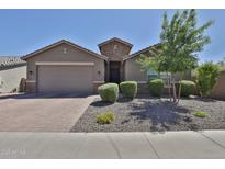 Charming single-story home featuring a brick driveway and desert landscaping at 2221 W Madisen Marie Ave, Queen Creek, AZ 85144