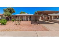 Charming single-story home with a covered carport and low maintenance desert landscaping at 2750 W Turney Ave, Phoenix, AZ 85017