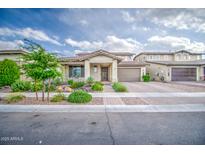 Charming single-story home showcasing desert landscaping, a two-car garage, and inviting curb appeal at 3879 E Harrison St, Gilbert, AZ 85295
