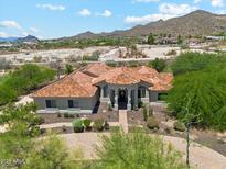 Stunning single-story home with a tile roof, desert landscaping, and a circular driveway at 8540 E Mcdowell Rd # 10, Mesa, AZ 85207