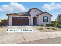 Charming single-story home with desert landscaping and a two-car garage at 9310 W Atlantis Way, Tolleson, AZ 85353