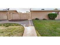 Inviting walkway to a home with well-maintained landscaping and privacy wall at 1310 S Pima -- # 6, Mesa, AZ 85210
