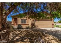 Charming single-story home with desert landscaping and a two-car garage at 2024 E Dust Devil Dr, San Tan Valley, AZ 85143