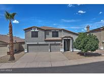 Charming two-story home with a three-car garage and desert landscaping in a sunny neighborhood at 20638 N 11Th St, Phoenix, AZ 85024