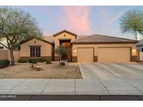 Charming single-story home with a neutral color palette, well-maintained landscaping, and a convenient two-car garage at 22231 N 55Th St, Phoenix, AZ 85054