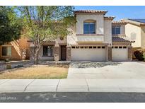 Charming two-story home featuring stucco finish, tile roof, a three-car garage, and well-maintained landscaping at 43232 W Magnolia Rd, Maricopa, AZ 85138