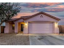 Charming single-story home with a two-car garage and low maintenance gravel landscaping at 9704 W Cordes Rd, Tolleson, AZ 85353