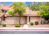 Charming home featuring desert landscaping, including beautiful trees and shrubs at 1633 E Lakeside Dr # 48, Gilbert, AZ 85234