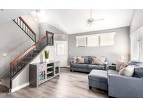 Bright living room with high ceilings, plenty of natural light, and staircase access at 1633 E Lakeside Dr # 48, Gilbert, AZ 85234