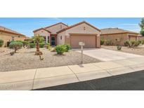 Charming single-story home with desert landscaping and a two-car garage at 16427 W Labyrinth Ln, Surprise, AZ 85374