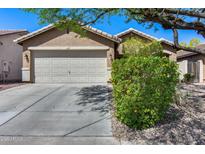 Charming home featuring a two-car garage, well-maintained landscaping, and a neutral color palette at 16820 N 152Nd Ln, Surprise, AZ 85374