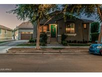 Charming home exterior with a well-manicured lawn, welcoming entrance and attached garage, creating curb appeal at 2721 E Tamarisk St, Gilbert, AZ 85296