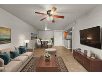 Cozy living room featuring comfortable seating, dining area, and a modern entertainment center at 540 N May N St # 3053, Mesa, AZ 85201