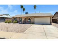Charming single-story home with low maintenance gravel front yard and attached two car garage at 2305 E Glade Ave, Mesa, AZ 85204
