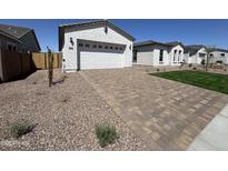 Charming single-story home featuring an attached garage and a nicely paved driveway in a well-maintained neighborhood at 26232 N 77Th Dr, Peoria, AZ 85383