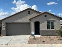 Charming single-story home featuring a two-car garage and desert landscaping for low maintenance at 25146 W Wayland Dr, Buckeye, AZ 85326