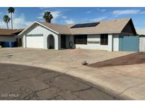 Charming single-story home featuring solar panels, a two-car garage, and low maintenance landscaping at 12836 N 39Th Ln, Phoenix, AZ 85029