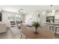 Bright living room with comfortable seating, modern decor, and seamless flow into the kitchen at 4100 S Pinelake Way # 121, Chandler, AZ 85249