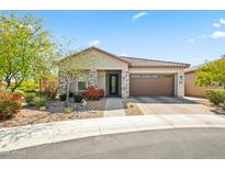 Charming single-story home featuring stone accents, a well-manicured yard, and a two-car garage in a residential neighborhood at 18129 N 65Th Pl, Phoenix, AZ 85054