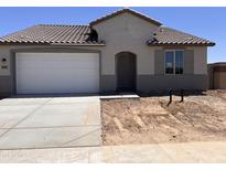 Charming single-story home with a two-car garage, desert landscaping, and a neutral color palette at 20601 N 226Th Dr, Surprise, AZ 85387