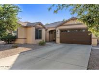 Charming single story home featuring a well-manicured yard and two car garage at 4554 S Cobblestone St, Gilbert, AZ 85297