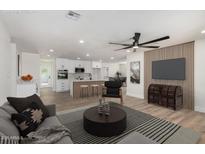 Staged living room showcasing the updated kitchen and living space in an open concept design at 1313 N 71St St, Scottsdale, AZ 85257