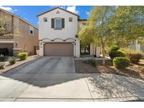 Charming two-story home with a well-maintained front yard and attached two-car garage at 20181 W Desert Bloom St, Buckeye, AZ 85326