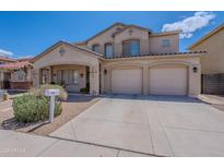 Inviting two-story home featuring a well-maintained front yard and a convenient three-car garage at 2911 W Keim Dr, Phoenix, AZ 85017