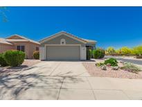 Charming single-story home featuring a well-maintained front yard and a two-car garage at 30440 N 42Nd Pl, Cave Creek, AZ 85331