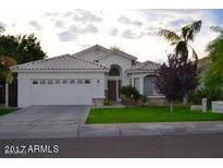 Charming single-story home featuring a manicured lawn and attached two-car garage at 3152 N 83Rd Pl, Scottsdale, AZ 85251