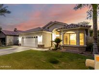 Charming single-Gathering home featuring a well-manicured lawn, brick accents, and a two-car garage at 3152 N 83Rd Pl, Scottsdale, AZ 85251