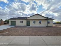 Charming single-story home featuring a cozy design and a well-maintained, spacious front yard at 350 N Florence St, Florence, AZ 85132