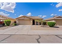 Charming single-story home with a well-maintained front yard and attached two-car garage at 1462 E Poncho Ln, San Tan Valley, AZ 85143