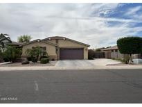 Charming single-story home with a well-maintained yard and attached two car garage at 2585 E Carob Dr, Gilbert, AZ 85298