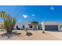 Charming single-story home featuring xeriscape landscaping and a welcoming front entrance at 14616 N 28Th Pl, Phoenix, AZ 85032