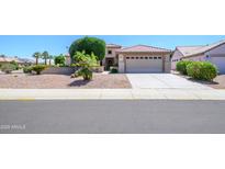 Charming single-story home with a two-car garage and attractive desert landscaping for easy care at 17371 N Natura Trl, Surprise, AZ 85374