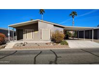 Charming single-story home with a carport and low-maintenance desert landscaping at 2400 E Baseline Ave # 144, Apache Junction, AZ 85119
