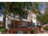 Inviting two-story townhome with charming brick accents and a cozy patio area at 706 E Washington St # 207, Phoenix, AZ 85034