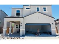 Two-story home featuring a covered entryway and a spacious garage at 5041 E Umber Rd, San Tan Valley, AZ 85143