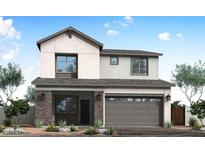 Charming two-story home featuring a modern design, two-car garage, and manicured landscaping at 1549 E Eleana Ln, Gilbert, AZ 85298