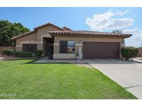 Charming single-story home featuring a well-manicured lawn and a two-car garage at 17806 N 54Th Ln, Glendale, AZ 85308