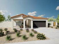 Charming single-story home with desert landscaping and a two-car garage on a sunny day at 17983 W Sand Hills Rd, Surprise, AZ 85387