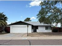 Charming single-story home featuring a two-car garage and a well-maintained front yard at 3150 E Corrine Dr, Phoenix, AZ 85032