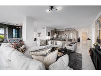Bright open-concept living room featuring a modern kitchen and stylish decor at 7180 E Kierland Blvd # 316, Scottsdale, AZ 85254