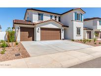 Inviting two-story home featuring a three-car garage and manicured landscaping at 10229 N 49Th Dr, Glendale, AZ 85302