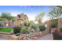 Southwest home featuring desert landscaping, private walkway, and entry gate at 14850 E Grandview Dr # 204, Fountain Hills, AZ 85268