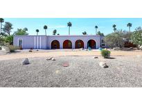 Charming home featuring an arched facade with a gravel yard and desert landscaping at 7537 W Bluefield Ave, Glendale, AZ 85308