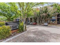 Biltmore Square condos with well-maintained landscaping and paved entrance, offering an inviting community atmosphere at 1701 E Colter St # 264, Phoenix, AZ 85016