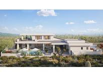 Expansive backyard with a pool, lounge area, and desert landscape, ideal for outdoor living at 17837 W Estes Way, Goodyear, AZ 85338