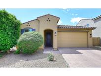 Charming single-story home with a well-manicured front yard and a two-car garage at 2425 E Beverly Rd, Phoenix, AZ 85042
